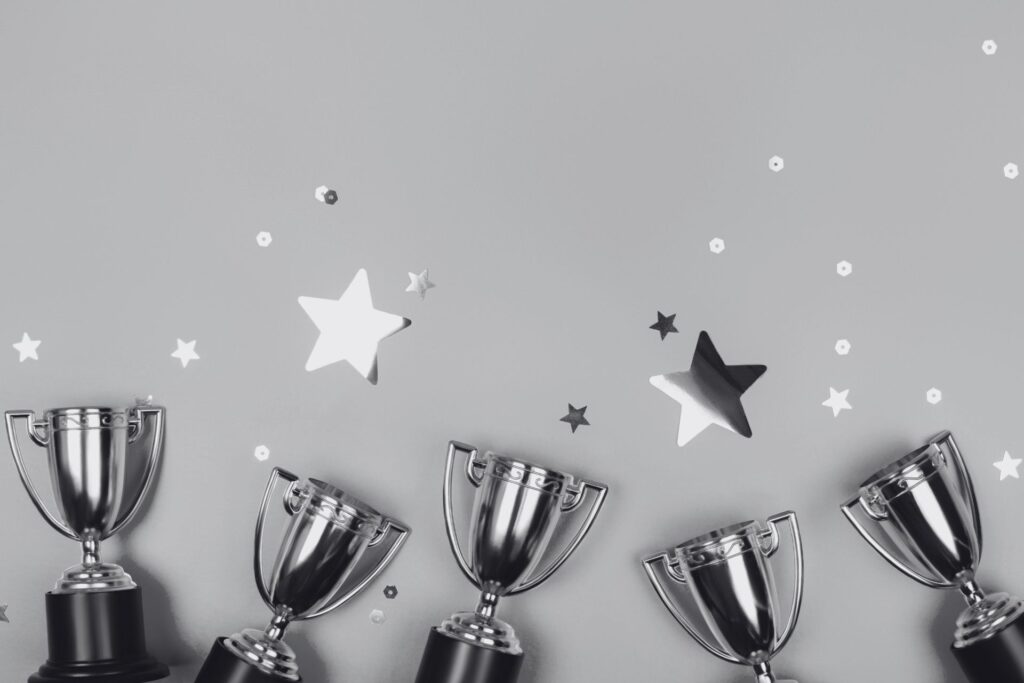 a line of trophies and gold starts