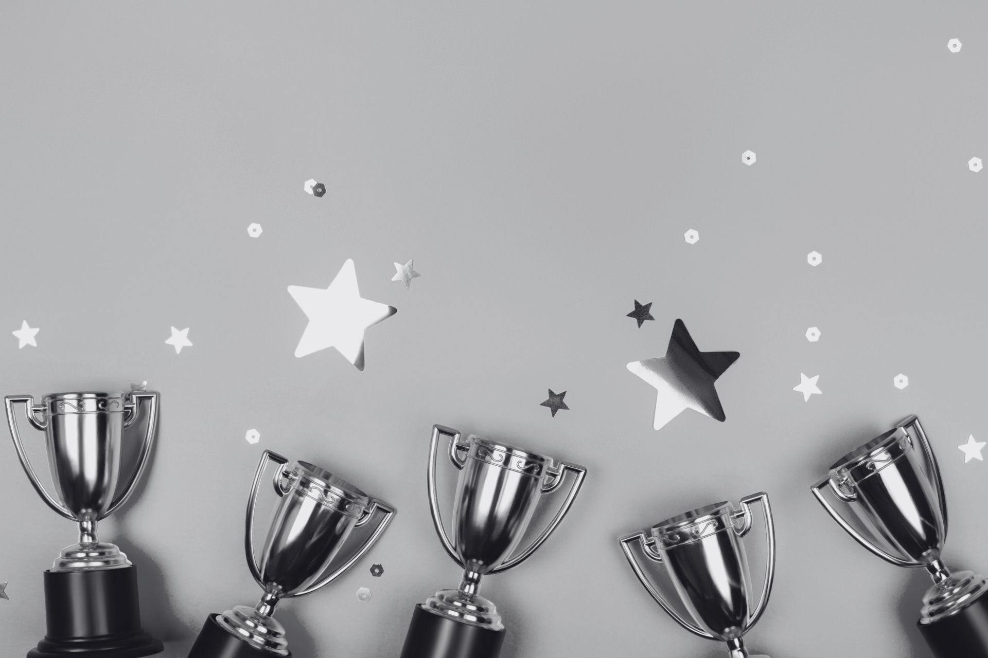 a line of trophies and gold starts