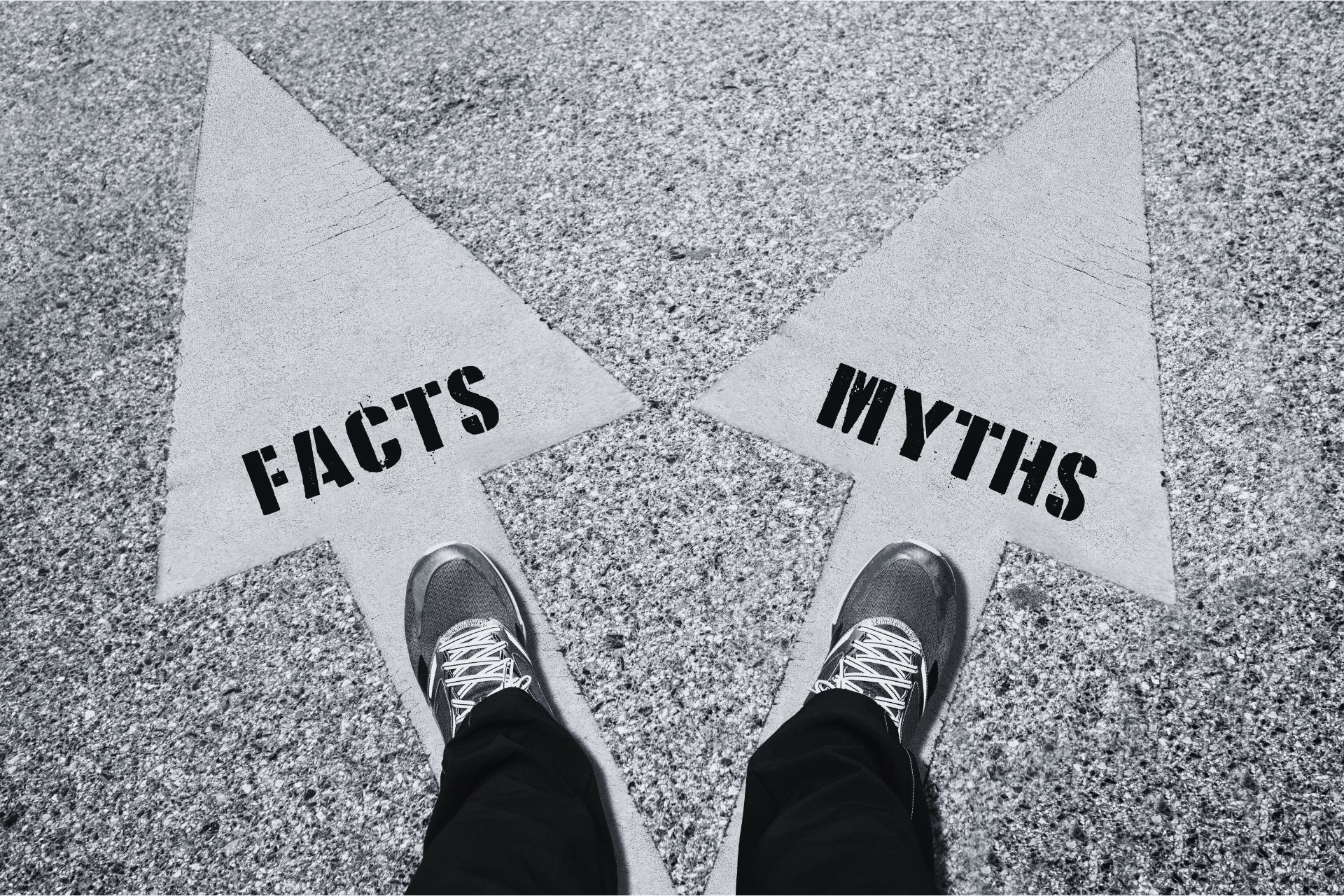 looking down at feet and two arrows, one saying 'myths' one saying 'facts'
